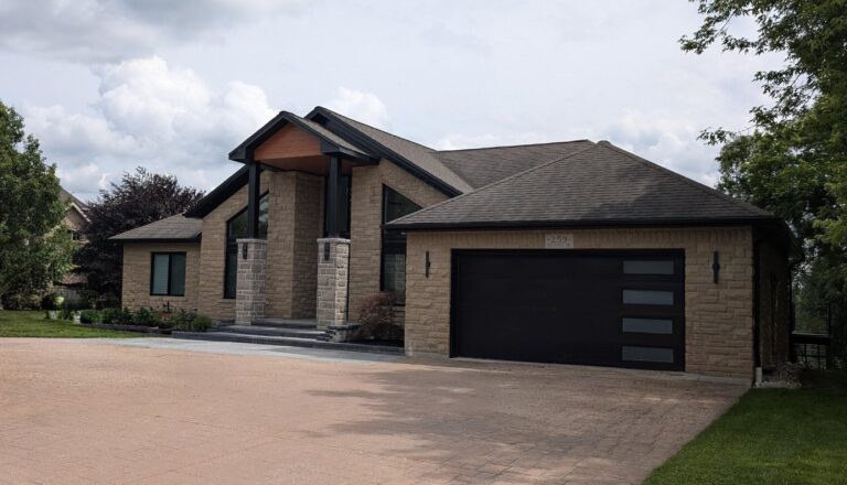 After exterior renovation in Kitchener. Modern with natural elements and black trim and accents.