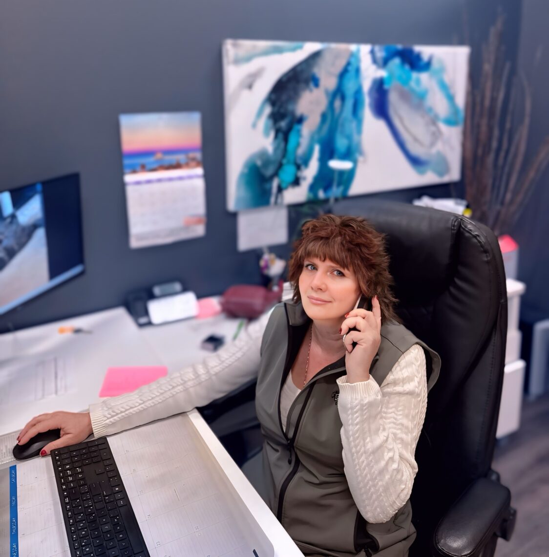 Nancy Hoodless at the BRICON office reception desk